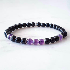 6mm size beads of purple Amethyst and Black Obsidian gemstones, with sterling silver rings as occasional spacers. Stretch bracelet