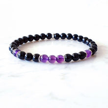 Load image into Gallery viewer, Stretch bracelet with purple Amethyst and Black Obsidian gemstones, with sterling silver rings as occasional spacers