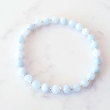 Load image into Gallery viewer, Aquamarine, blue crystal stretch bracelet with sterling silver beads and rings
