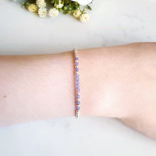 Load image into Gallery viewer, Silver beaded bracelet with purple/blue beaded gemstones in the centre