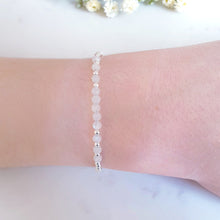 Load image into Gallery viewer, Round moonstone beads, clear in colour, in the centre of round sterling silver beads