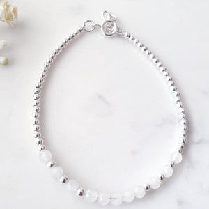 Moonstone gemstone beads in the centre of round silver beads