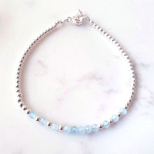 Load image into Gallery viewer, Blue gemstone beaded bracelet in the centre of sterling silver beads