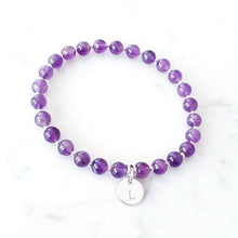 Load image into Gallery viewer, 6mm amethyst beaded bracelet with 10mm initial charm.  Bracelet has small sterling silver beads inbetween.  
