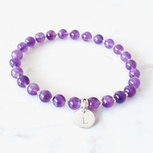 Load image into Gallery viewer, 6mm amethyst gemstone bracelet with 10mm disc charm. Bracelet has small sterling silver beads inbetween.