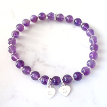 Load image into Gallery viewer, 6mm amethyst gemstone bracelet with 7mm heart charm. Bracelet has small sterling silver beads inbetween.