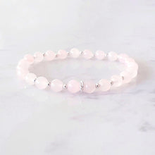 Load image into Gallery viewer, 6mm rose quartz bracelet, with 3 linked rings in the centre and silver beads inbetween each gemstone