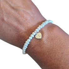 Load image into Gallery viewer, Dainty pearl bracelet with a personalised sterling silver heart charm in the centre
