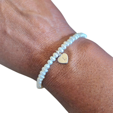 Dainty pearl bracelet with a personalised sterling silver heart charm in the centre