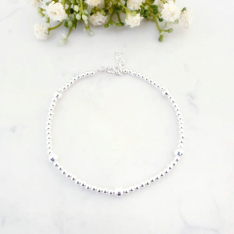 Sterling silver beaded anklet with 5 disco beads
