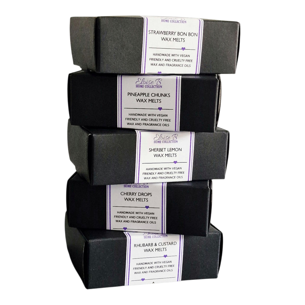 Stack of wax melts in black boxes 