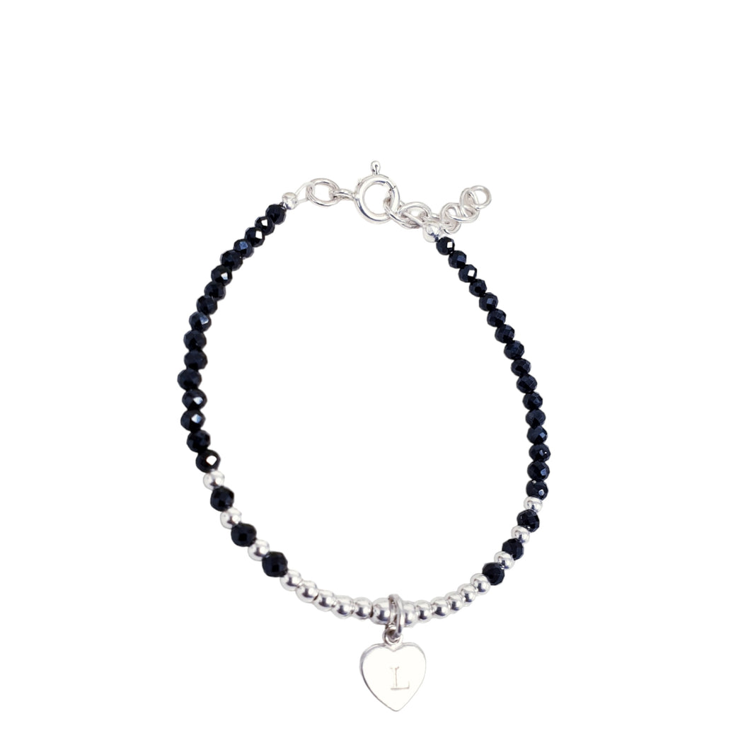 black beaded bracelet with an initial charm sterling silver