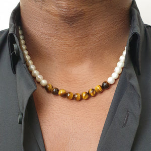 White pearl necklace with 9 centred tigers eye beads 