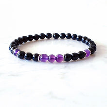 Load image into Gallery viewer, Stretch bracelet with purple Amethyst and Black Obsidian gemstones, with sterling silver rings as occasional spacers
