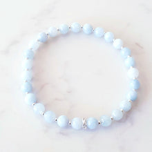 Load image into Gallery viewer, Aquamarine, blue crystal stretch bracelet with sterling silver beads and rings
