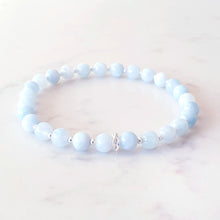 Load image into Gallery viewer, Aquamarine, light blue gemstone stretch bracelet with sterling silver beads and rings
