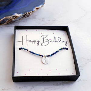 blue spinel bracelet with letter charm