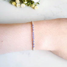 Load image into Gallery viewer, Silver beaded bracelet with purple/blue beaded gemstones in the centre
