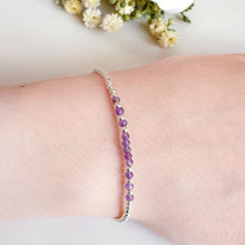 Load image into Gallery viewer, Purple Amethyst beads surrounded by silver beads in a bracelet
