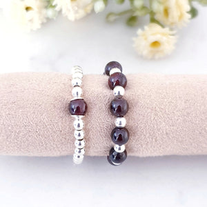Deep red gemstone with alternating sterling silver beads