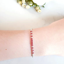 Load image into Gallery viewer, Red Garnet faceted gemstones in the centre of sterling silver beads

