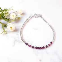 Load image into Gallery viewer, Faceted rubies in the centre with sterlng silver beads

