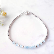 Load image into Gallery viewer, Light blue gemstone beaded bracelet in the centre of sterling silver beads
