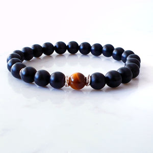 8mm matt black agate bracelet with a tigers eye stone in the centre and sterling silver rings