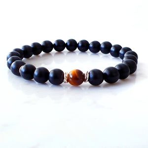 8mm matt black agate bracelet with a tigers eye stone in the centre and sterling silver rings