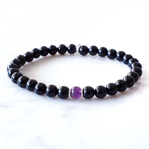 6mm bead, Black Obsidian with Amethyst centre bead with sterling silver rings.  Stretch bracelet