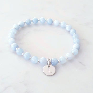Aquamarine, light blue gemstone bracelet with sterling silver beads and a personalised disc charm