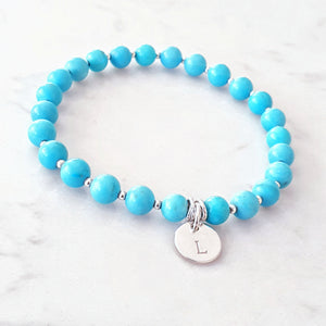 Blue Howlite beaded bracelet with sterling silver beads inbetween and a personalised disc charm