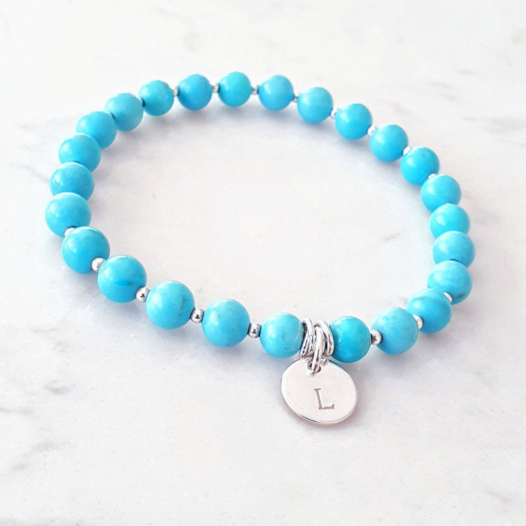 Blue Howlite beaded bracelet with sterling silver beads inbetween and a personalised disc charm
