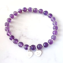 Load image into Gallery viewer, 6mm amethyst gemstone bracelet with 7mm heart charm.  Bracelet has small sterling silver beads inbetween.  
