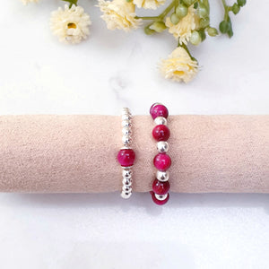 Fuschia pink beads with sterling silver beads, stretch ring