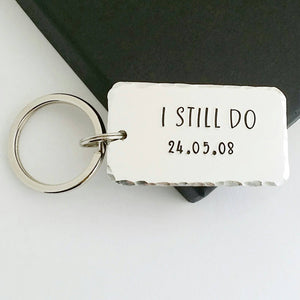 Personalised I STILL DO keyring.  Add anniversary date.  45mm x 25mm, textured around the edges.  Small and large split rings.  Silver aluminium.  