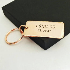 Personalised copper keyring, hand stamped I STILL DO, with the option to add your anniversary date.  Keyring is 45mm x 25mm, textured around the edges and comes with small and large copper finish split rings.  