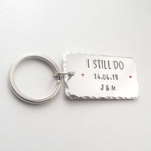 Personalised I STILL DO keyring with red hearts.  Add anniversary date and initials. 45mm x 25mm, textured around the edges.  Silver aluminium.  