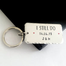 Load image into Gallery viewer, Personalised I STILL DO keyring with red hearts.  Add anniversary date and initials. 45mm x 25mm, textured around the edges.  Small and large split rings.  Silver aluminium.   
