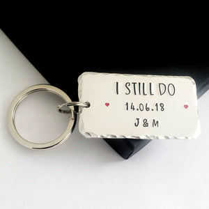 Personalised I STILL DO keyring with red hearts.  Add anniversary date and initials. 45mm x 25mm, textured around the edges.  Small and large split rings.  Silver aluminium.   
