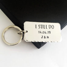 Load image into Gallery viewer, Personalised I STILL DO keyring with red hearts.  Add anniversary date and initials. 45mm x 25mm, textured around the edges.  Silver aluminium.  
