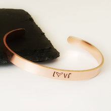 Load image into Gallery viewer, Copper bangle cuff hand stamped with LOVE or personalised with wording of your choice. 150mm x 6mm copper bangle.  
