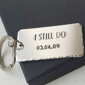 Personalised I STILL DO keyring.  Add anniversary date.  45mm x 25mm, textured around the edges.  Small and large split rings.  Silver aluminium.     