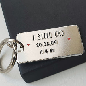 Personalised I STILL DO keyring with red hearts.  Add anniversary date and initials. 45mm x 25mm, textured around the edges.  Silver aluminium.    